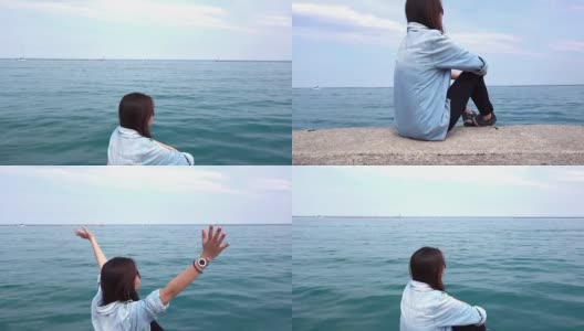 亚洲女人放松与密歇根湖背景，芝加哥，伊利诺斯州，美国高清在线视频素材下载