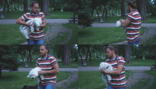 一个人和他的狗在公园里高清在线视频素材下载