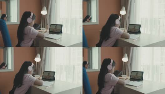 亚洲女孩在家通过视频学习高清在线视频素材下载