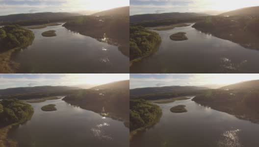 无人机拍摄的被森林包围的湖泊高清在线视频素材下载