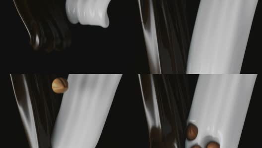 核桃溅成一排一排的黑巧克力和牛奶高清在线视频素材下载