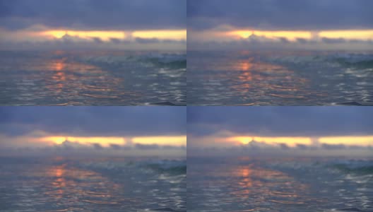 水的纹理与彩色的日落反射，田园诗般的宁静的海洋或海浪，海洋的自然美景高清在线视频素材下载