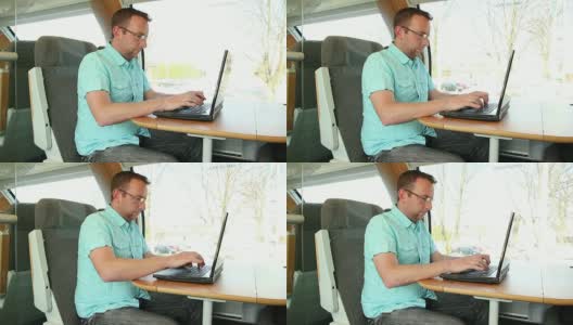 在火车上使用笔记本电脑的人高清在线视频素材下载