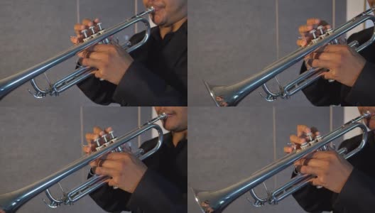 音乐室背景中音乐人演奏按键和按喇叭的视频。从右到左的平面，音乐概念高清在线视频素材下载