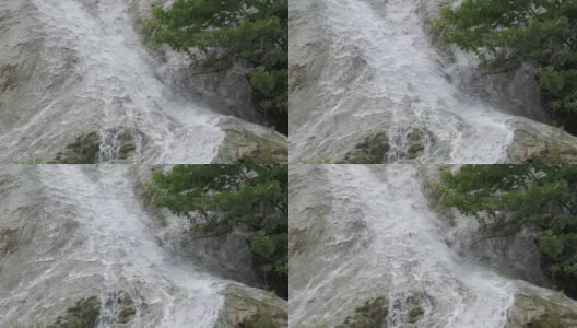 瀑布的水从倾斜的岩石上泻下高清在线视频素材下载