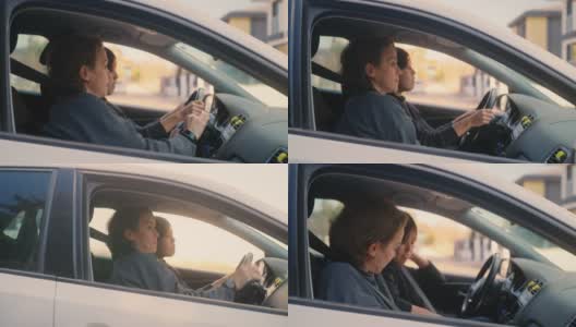 驾校的女教师正在教年轻女子如何开车。高清在线视频素材下载