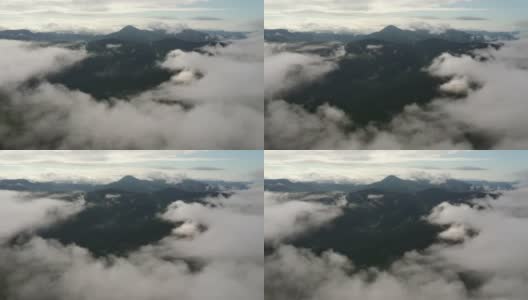 群山耸立在浓雾的云层之上。高清在线视频素材下载