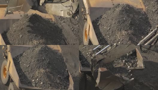 挖土机将土装入矿用卡车高清在线视频素材下载