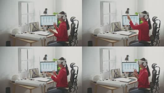 女工程师戴着虚拟现实耳机在Metaverse工作高清在线视频素材下载