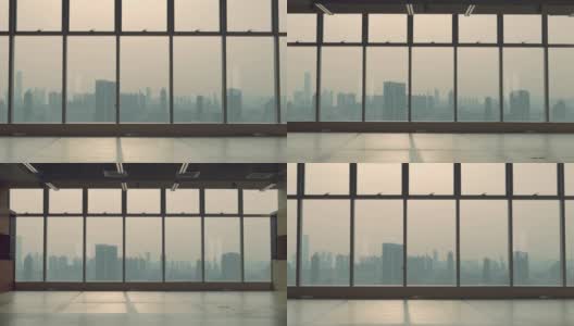 从办公室窗口可以看到香港城市的雾霾天气。高清在线视频素材下载