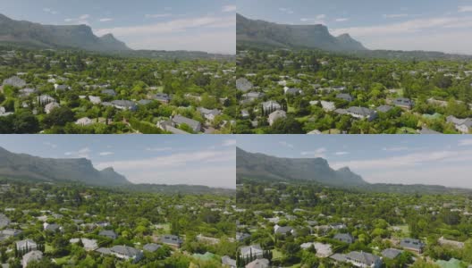 位于城市郊区的住宅区。绿色植被环绕的现代家庭住宅。山的背景。南非开普敦高清在线视频素材下载