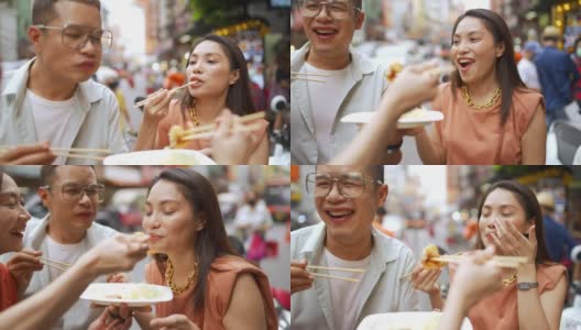 4K群亚洲人朋友一起走在唐人街一起吃街头小吃高清在线视频素材下载
