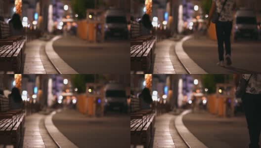 法国格拉斯夜间的街景。散焦，行走的人，夜灯高清在线视频素材下载