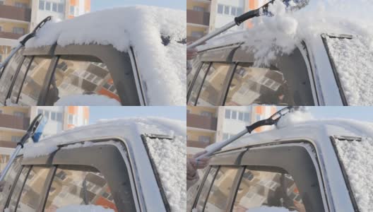 一位妇女的手拿着一把刷子从一辆SUV的车顶扫雪高清在线视频素材下载