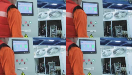 在实验室工作台上测试冷却系统的工人高清在线视频素材下载