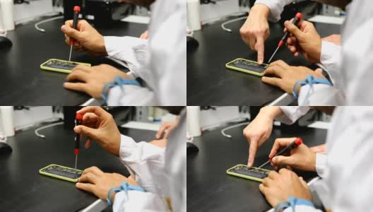修理智能手机的工程师裁剪的手高清在线视频素材下载