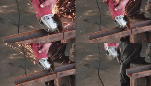 一名男子正在用圆形涡轮机切割一根生锈的金属横梁。角磨机慢动作完成工作声音高清在线视频素材下载