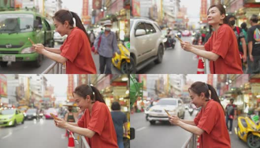 在泰国曼谷的夜市，一名4K亚洲妇女在使用智能手机旅行高清在线视频素材下载