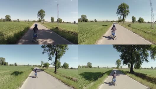 蹒跚学步的孩子正在学习骑他的新自行车高清在线视频素材下载