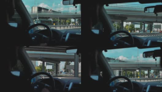 从城市道路上行驶的汽车窗口俯瞰城市风景高清在线视频素材下载