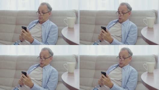 上了年纪的人喜欢看智能手机。新高清在线视频素材下载