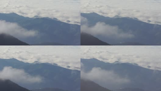 云雾飘过山顶的戏剧性场面。高清在线视频素材下载