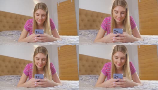 漂亮的白人女性在卧室里用手机应用程序打字。美丽的年轻成年白人女性在近距离4l视频与现代智能手机和社交媒体应用程序在线交流高清在线视频素材下载