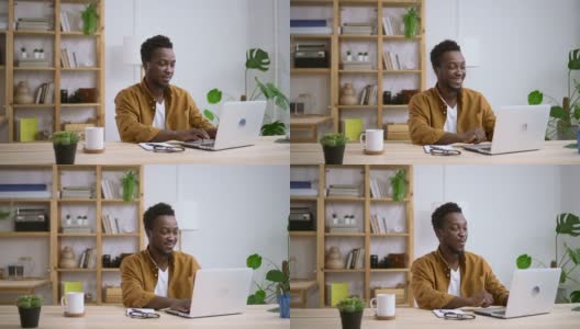一名非洲男子惊讶地在家里的电脑上看到了Spbas高清在线视频素材下载