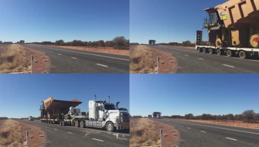 超大型车队在澳大利亚内陆红色中心的斯图亚特高速公路上行驶高清在线视频素材下载