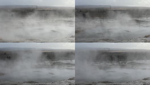 摇摄:冰岛斯特罗库尔间歇泉的游客高清在线视频素材下载