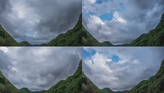 雨云在山谷树木繁茂的山坡上快速移动高清在线视频素材下载