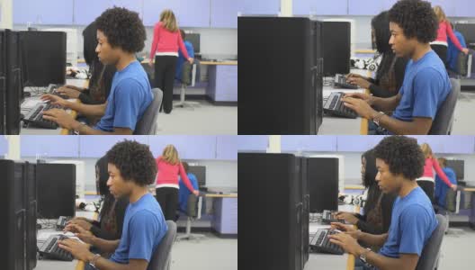 男学生在教室里使用电脑高清在线视频素材下载