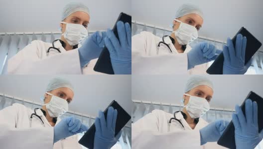 女性外科医生使用片剂高清在线视频素材下载