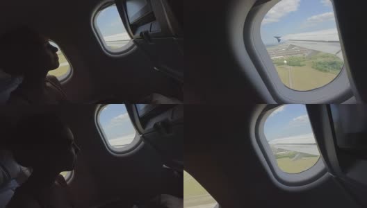 飞机上的年轻女子在飞机起飞时望着窗外高清在线视频素材下载