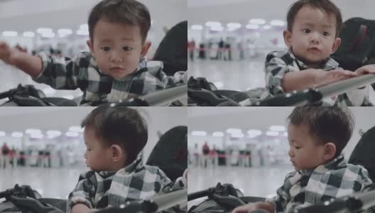 亚洲婴儿车上的男婴。高清在线视频素材下载