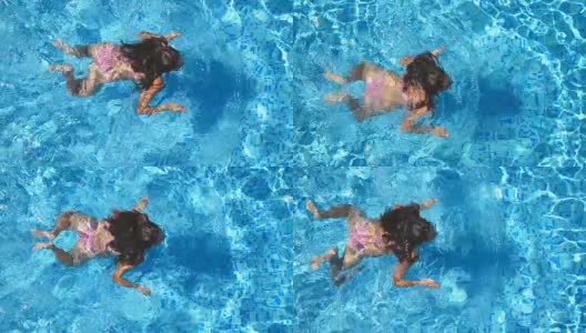 年轻美丽的女孩在粉红色比基尼漂浮在酒店的游泳池。在一个阳光明媚的日子里，一个不可辨认的棕色头发的女人在清澈的蓝色水池里游泳。暑假或假期的概念。俯视图特写高清在线视频素材下载