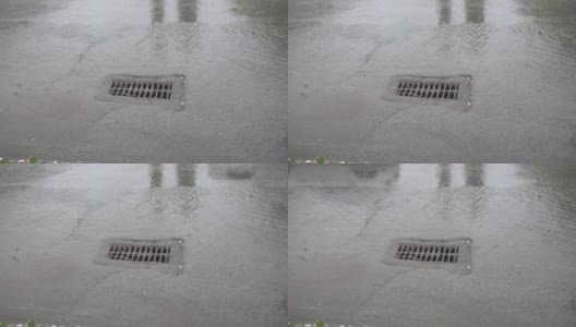 春季下雨时，雨水下水道筛。水坑里一辆经过的汽车的倒影高清在线视频素材下载