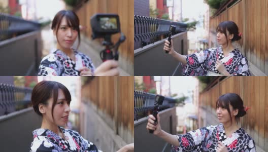 一名日本女子在一条狭窄的小路上发视频高清在线视频素材下载