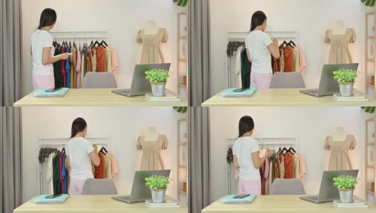 亚洲女企业家注意并检查库存的服装产品在网上服装商店高清在线视频素材下载