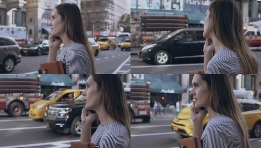 年轻的女商人拿着文件打电话。在美国纽约，一个拿着智能手机的女性高清在线视频素材下载