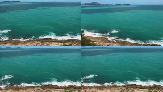 碧绿的海浪拍打着岩石，从山顶俯瞰高清在线视频素材下载