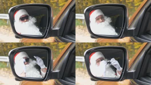 圣诞老人在车里以50帧/秒的速度摘下太阳镜高清在线视频素材下载