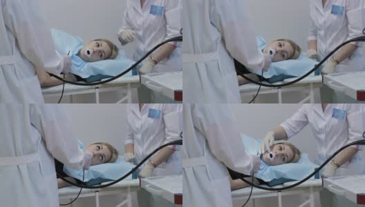 医生把内窥镜放进女孩的嘴里是一种医疗器械高清在线视频素材下载