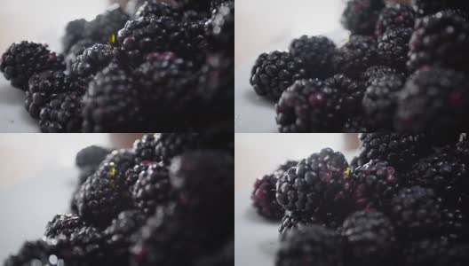 早餐桌上放着新鲜的黑莓。高清在线视频素材下载