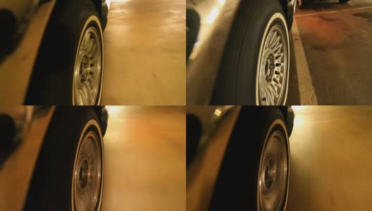 安装在汽车侧面的摄像头。车的轮子在停车场行驶高清在线视频素材下载