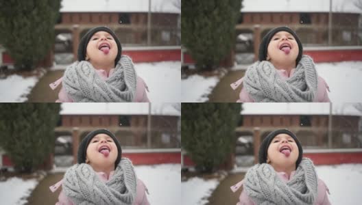可爱的孩子在城市户外享受雪天高清在线视频素材下载