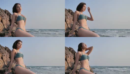 年轻女子在热带海滩上的比基尼肖像。穿着泳装的漂亮女孩。暑假和晒黑的概念。享受。的生活方式。自由。旅行。假期——iStock高清在线视频素材下载