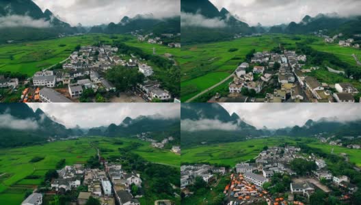 鸟瞰喀斯特山峰森林(万峰林)中的村庄和稻田，贵州，中国。高清在线视频素材下载