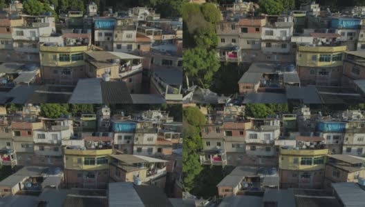 日出时，巴西里约热内卢，空中追踪经过山顶上树木之间密集的贫民窟住宅高清在线视频素材下载