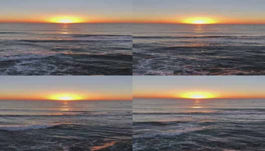 从海滩上看到海面上的红色日出高清在线视频素材下载